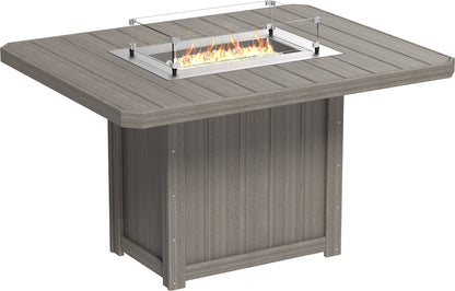 Vivid representation of the Lumin 62" Fire Table in Coastal Gray, set for a cozy outdoor gathering.