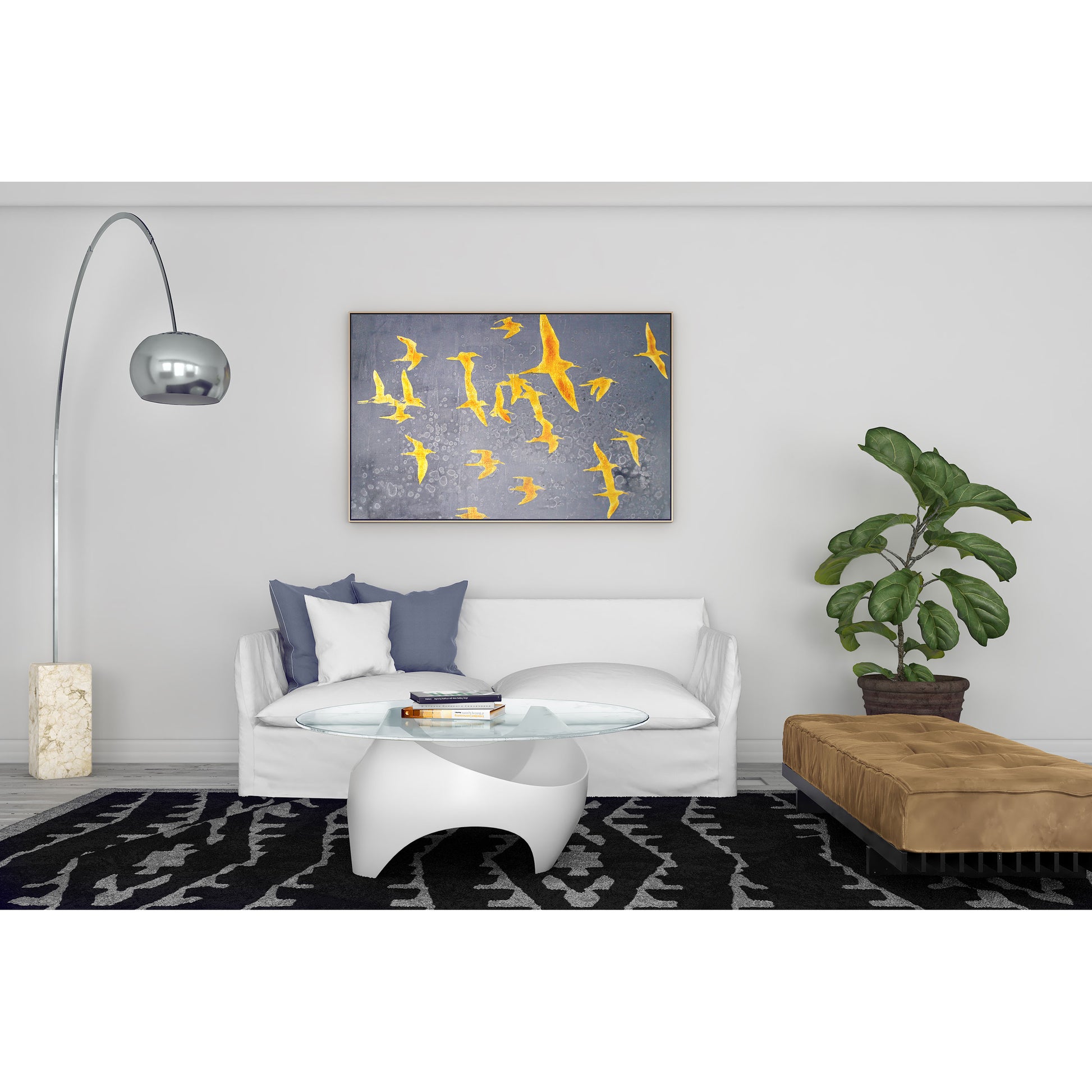 Gold birds painting hung in a modern living room with a white sofa and floor lamp.