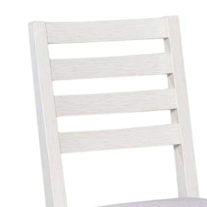 Close-up of the ribbed backrest on a white wooden dining chair, highlighting the elegant drift finish and classic design.