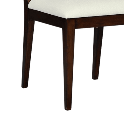 Legs of a brown wood dining chair showcasing tapered design and sturdy construction.