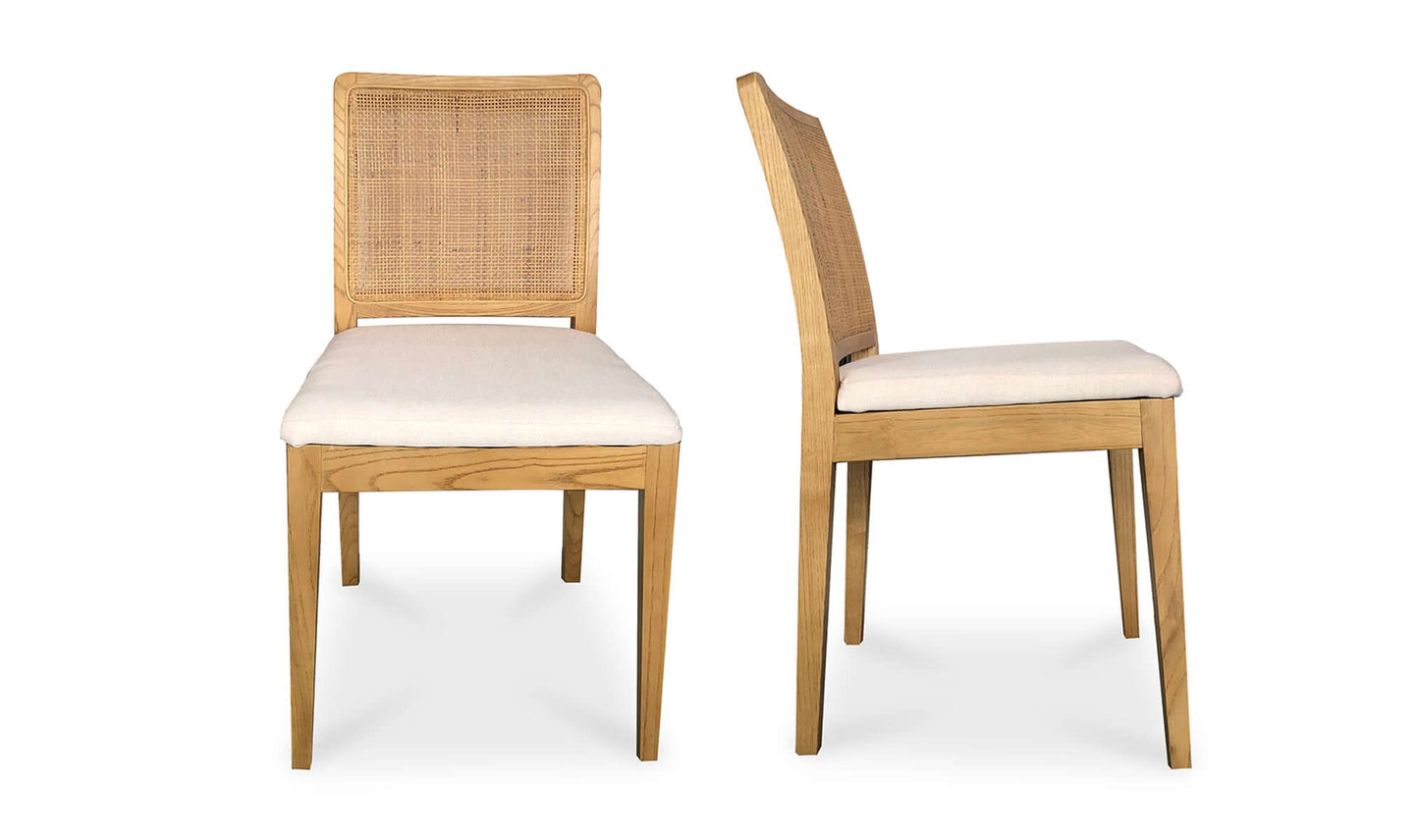 Pair of Orville Natural Dining Chairs showcasing rattan back and white cushions