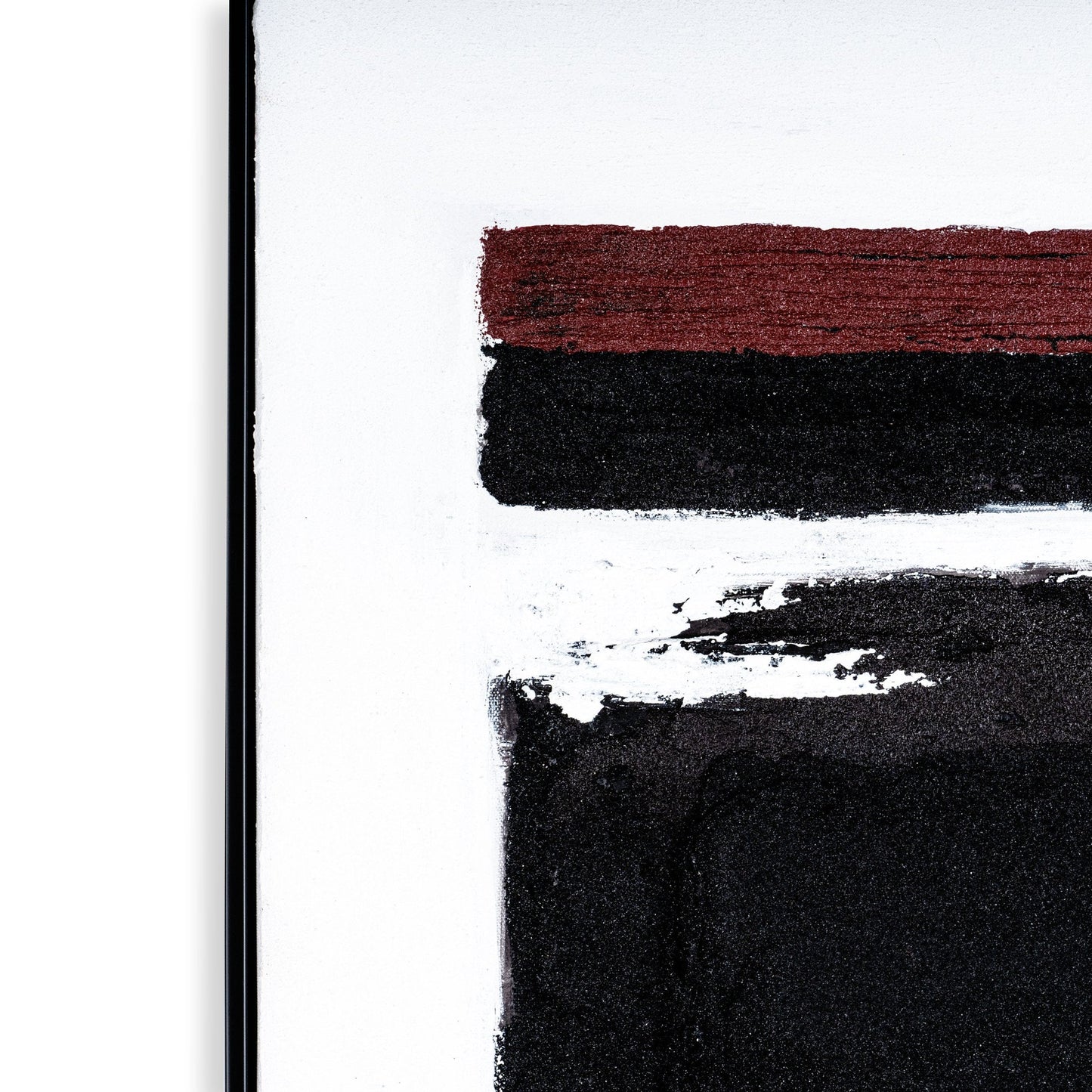 Close-up of red and black textured brushstrokes on a white canvas, framed in sleek black.