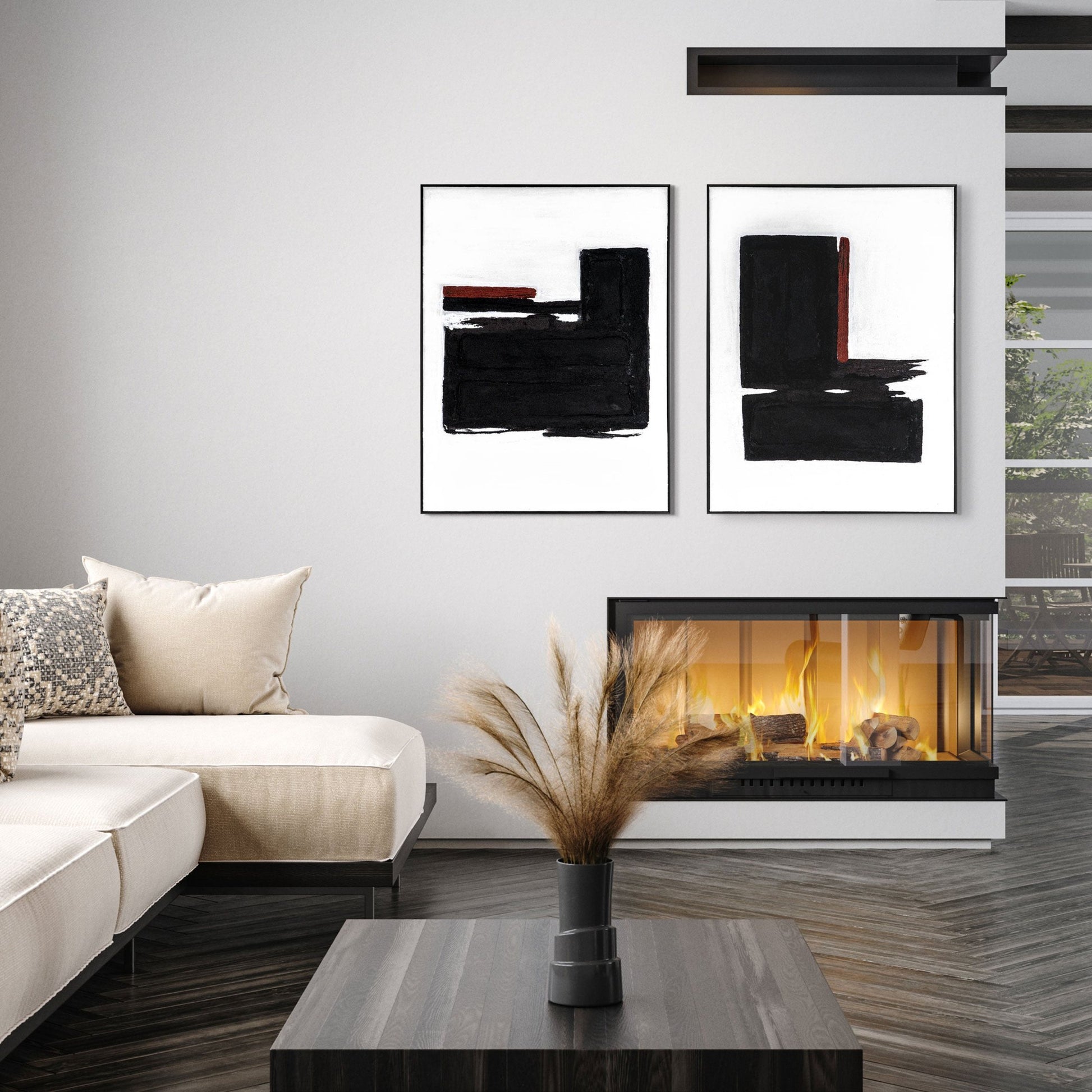 Set of two modern abstract artworks above a contemporary fireplace.