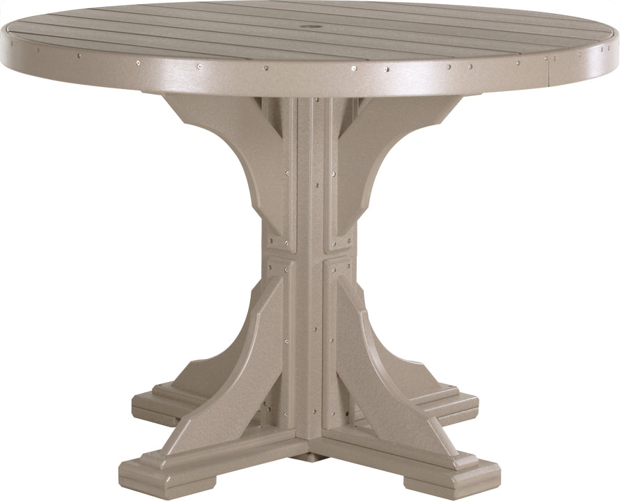 Weatherwood 4' Poly Round Dining Table, timeless finish for a comfortable dining area.