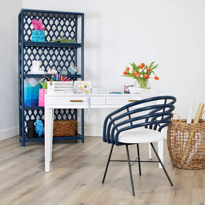 Stylish blue Madrid Dining Chair with black steel legs in a creative workspace.