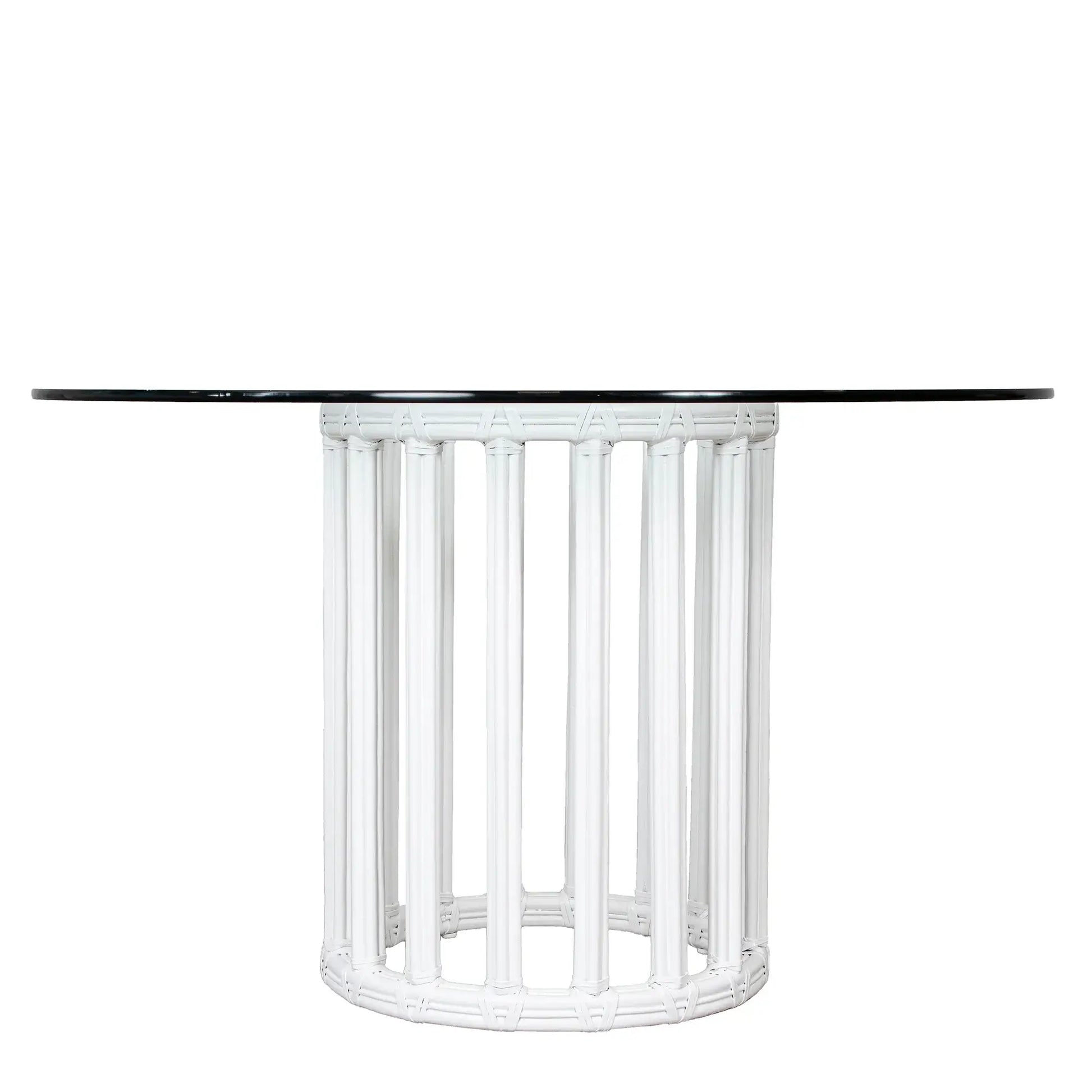 White round metal table base with rattan and glass top, perfect for enhancing a dining room's aesthetic.