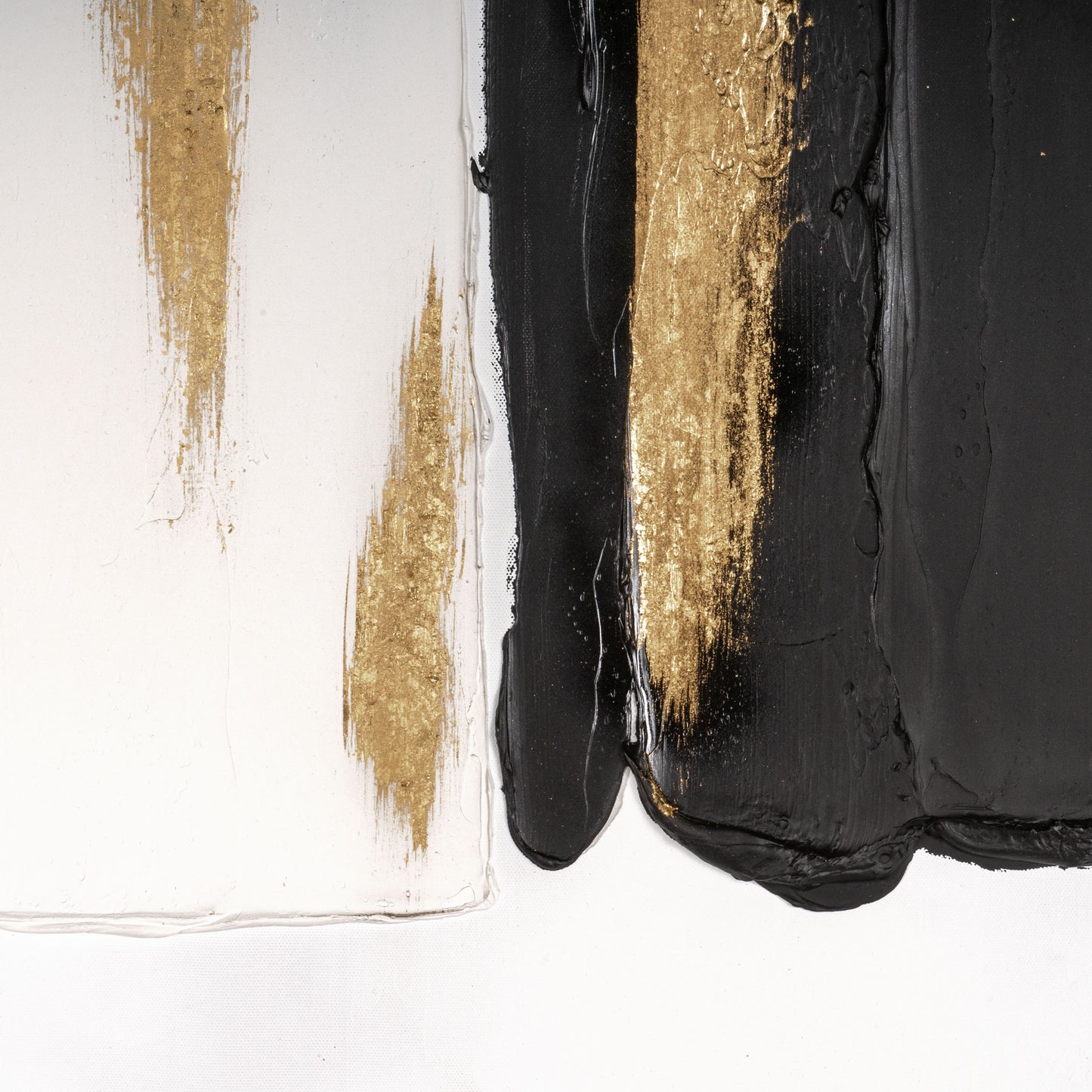 Detailed view of gold and black paint textures on Abstract Harmony canvas.