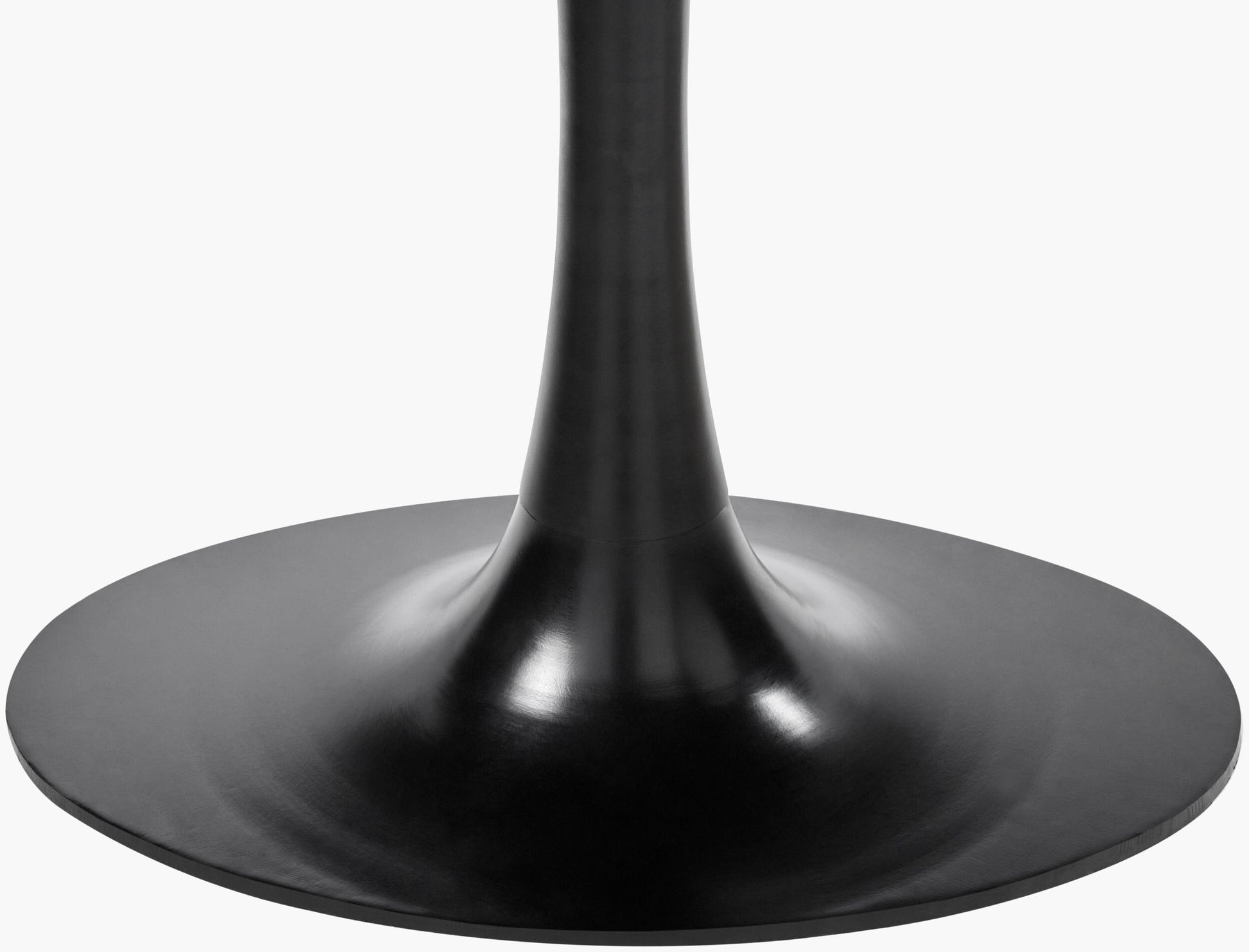 Close-up of black powder-coated iron base of Anatalia modern marble dining table.