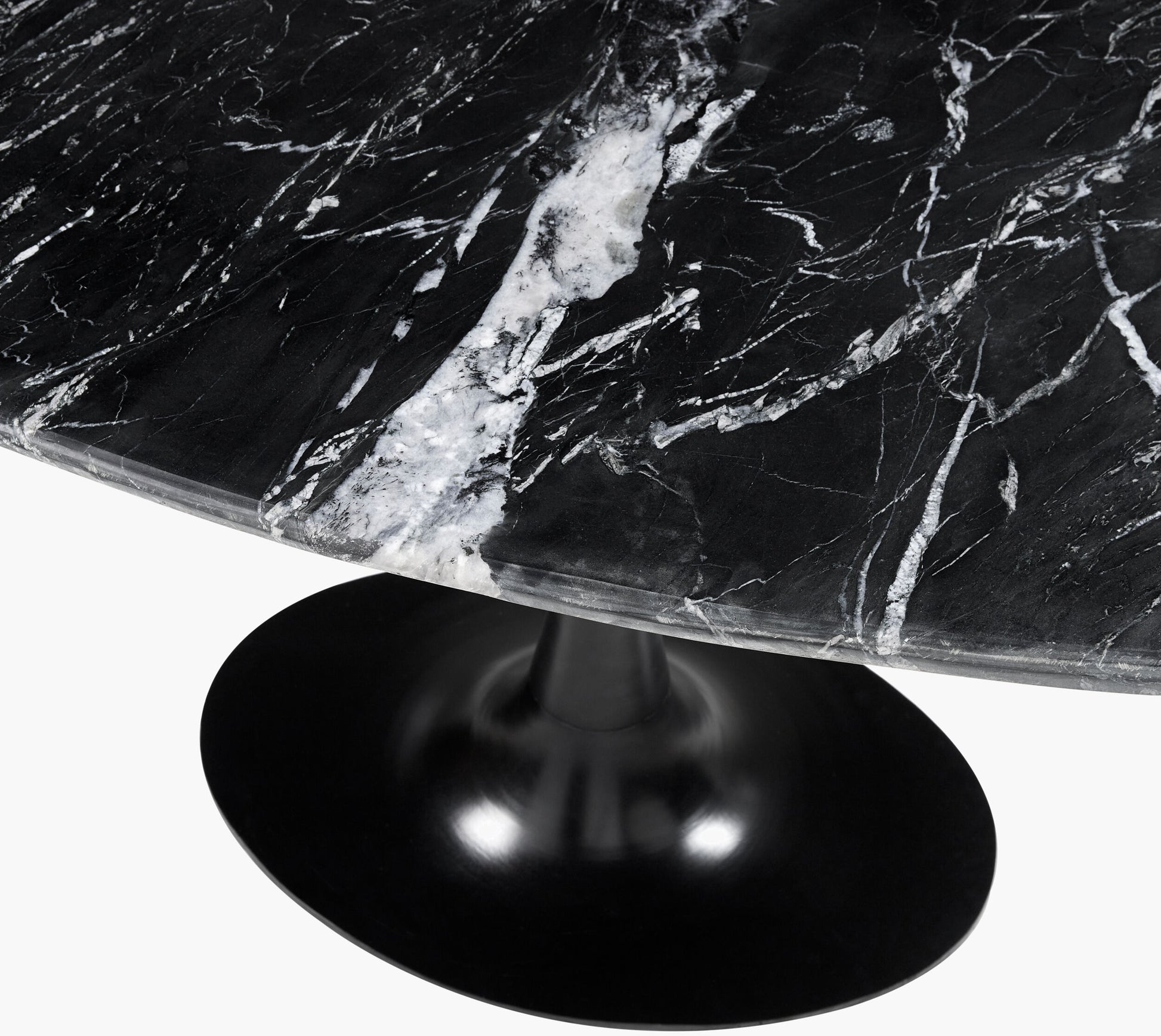 Detailed view of the antalia black marble top with white veining.