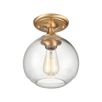 Brass semi flush mount with handblown round clear glass shade and warm exposed bulb lighting.