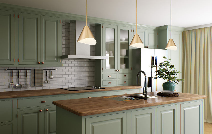 Modern gold pendant lights in sage green kitchen.