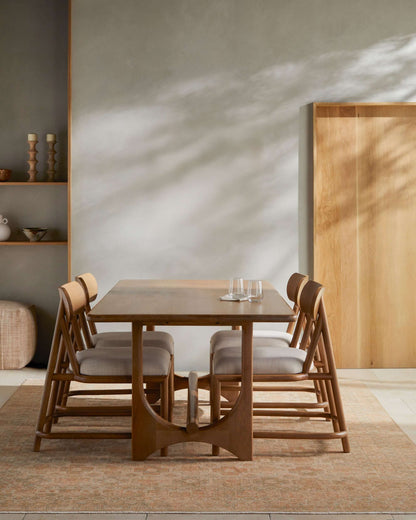 Arland Brown Scandinavian Dining Table in a contemporary dining space with chairs.