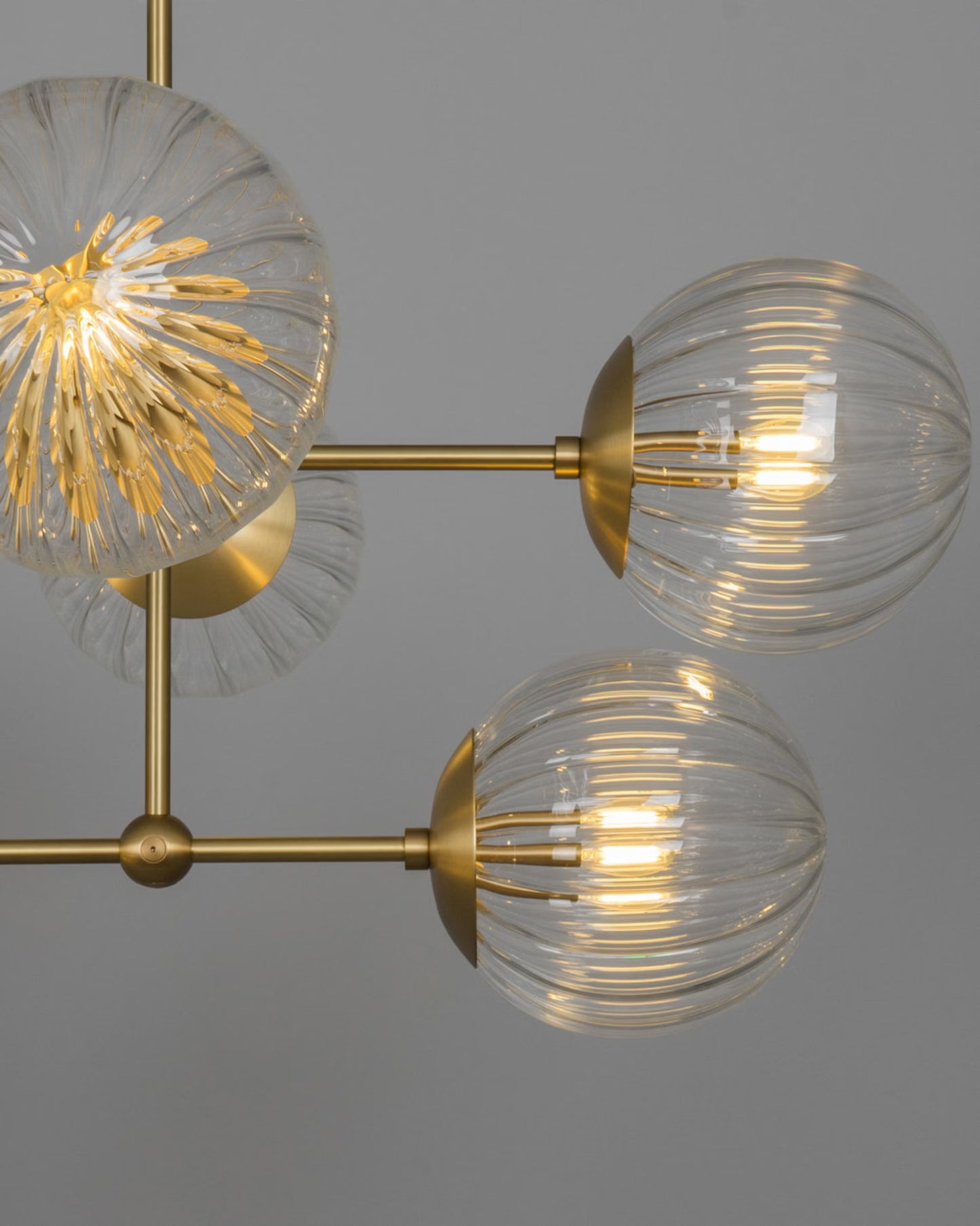 Close-up of Armstrong Linear Chandelier with handblown glass globes and brass details.