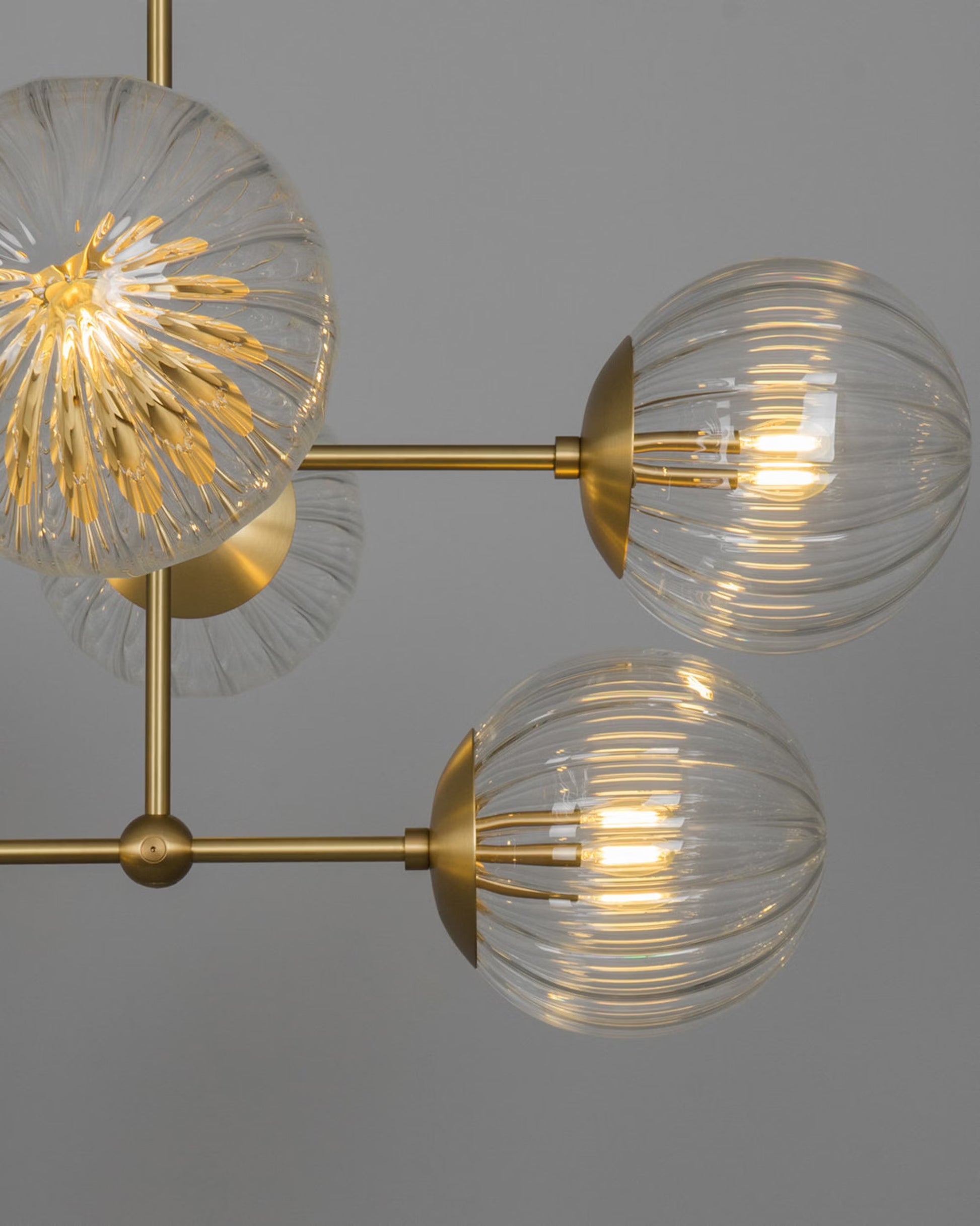 Close-up of Armstrong Linear Chandelier with handblown glass globes and brass details.