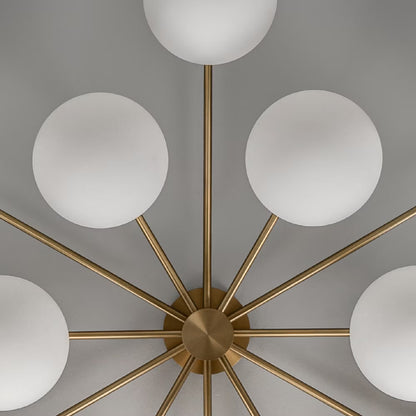 Detailed view of Armstrong Linear Chandelier’s brass frame and handblown glass globe connection.