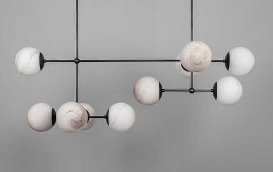 Armstrong Linear Chandelier with marble matte globes in a black gunmetal finish, unlit.