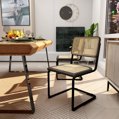 Side view of Black/Brown Arwan Cane Dining Chairs around a set table.