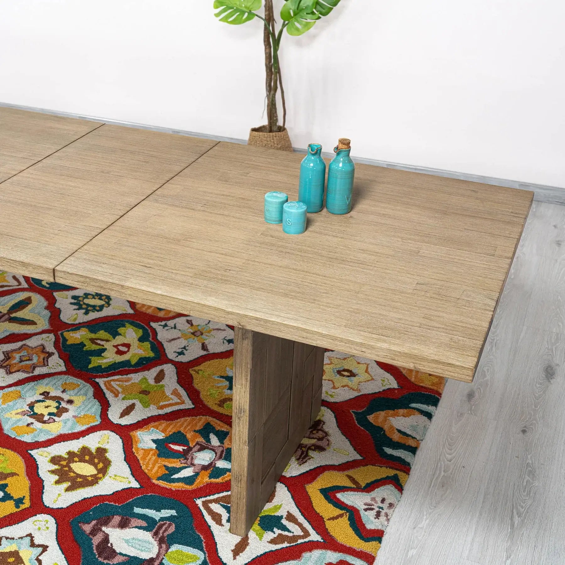 Top-down view of Atlantis extendable dining table, highlighting the brushed light taupe finish.