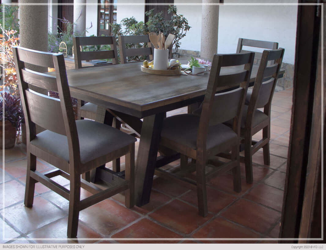 Antique Gray Dining Table set in a rustic outdoor dining space with surrounding greenery