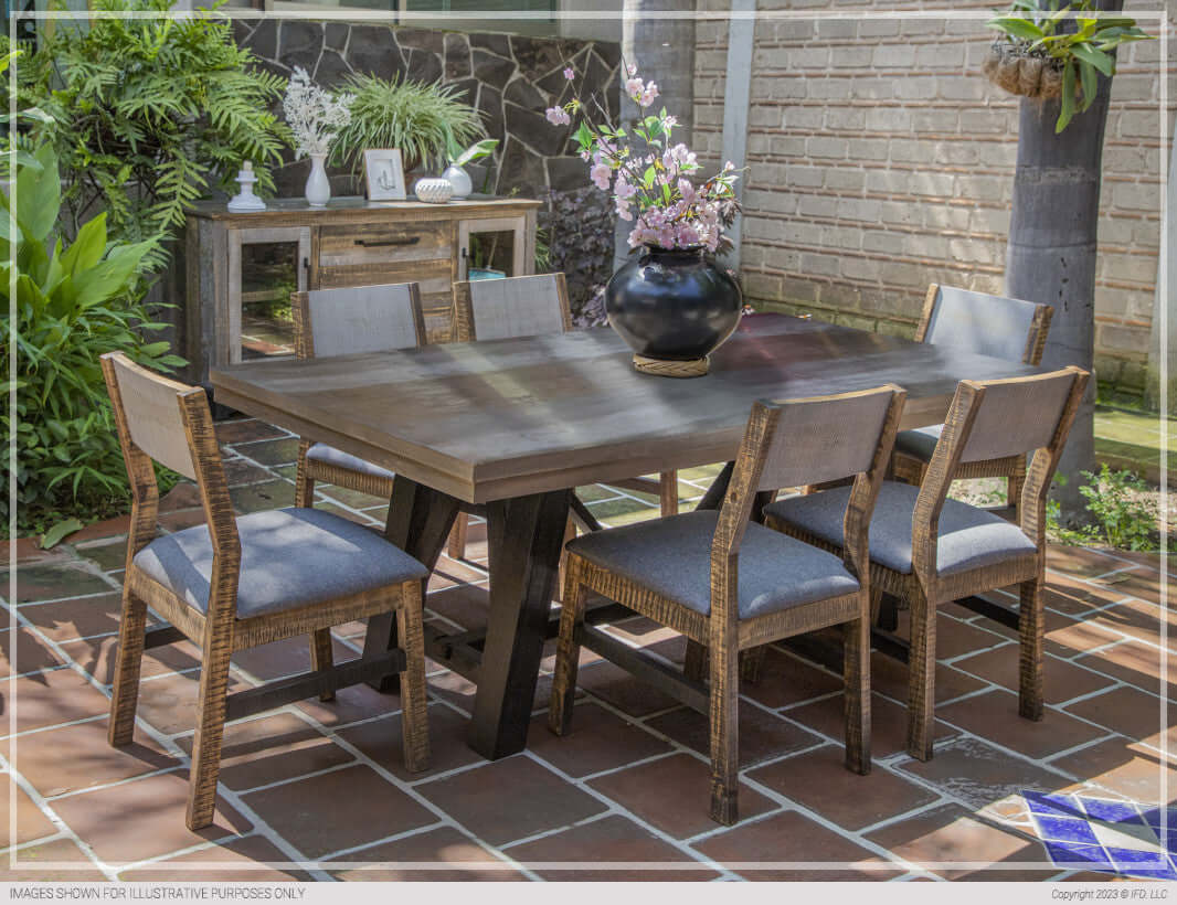 Elegant dining setup featuring Loft Brown Dining Chairs with grey fabric seats around a rustic dining table.