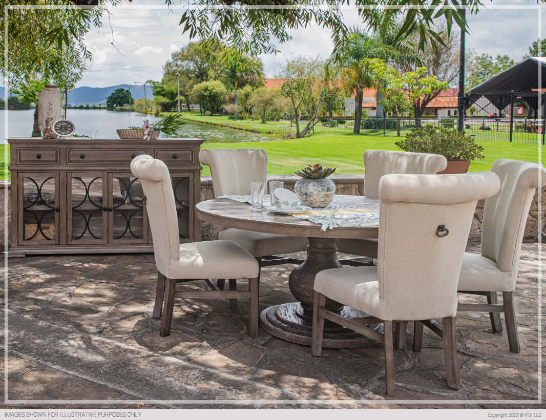 Outdoor setting with Bonanza Round Dining Table and upholstered chairs.