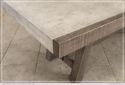 Edge detail of faux marble dining table with wooden legs.