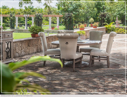 Bonanza Round Dining Table set for dining in a lush garden.