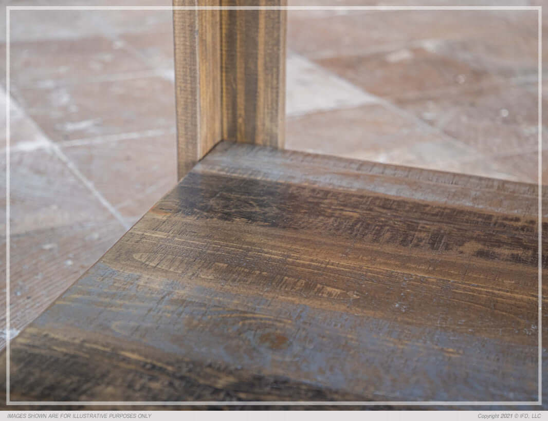 Close-up of the base of the Loft Brown 54" Square Dining Table showing the solid wood and durable construction.