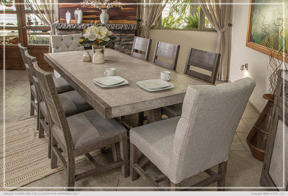 Cozy dining room with a faux marble dining table and wooden chairs.