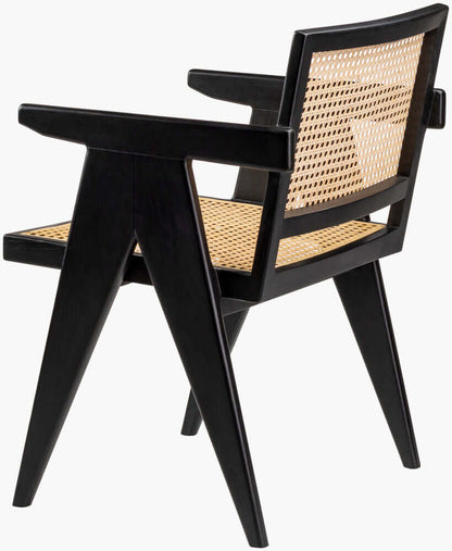 Angled back view of Surya Hague Rattan Dining Arm Chair in black, emphasizing its rattan craftsmanship.