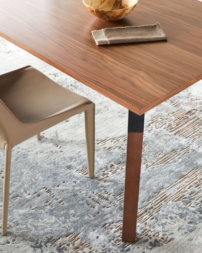 Close-up of the Billings Dining Table by Surya highlighting the wood veneer top and sturdy leg design.