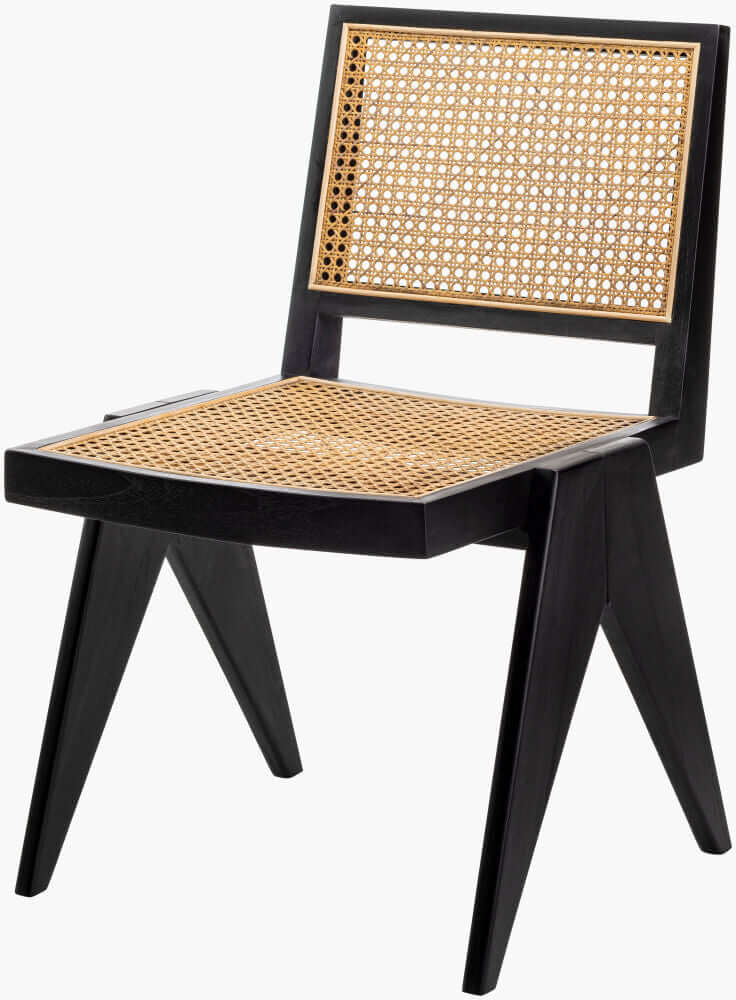 Angled view of a black rattan dining chair, emphasizing its unique geometric design and woven seat.