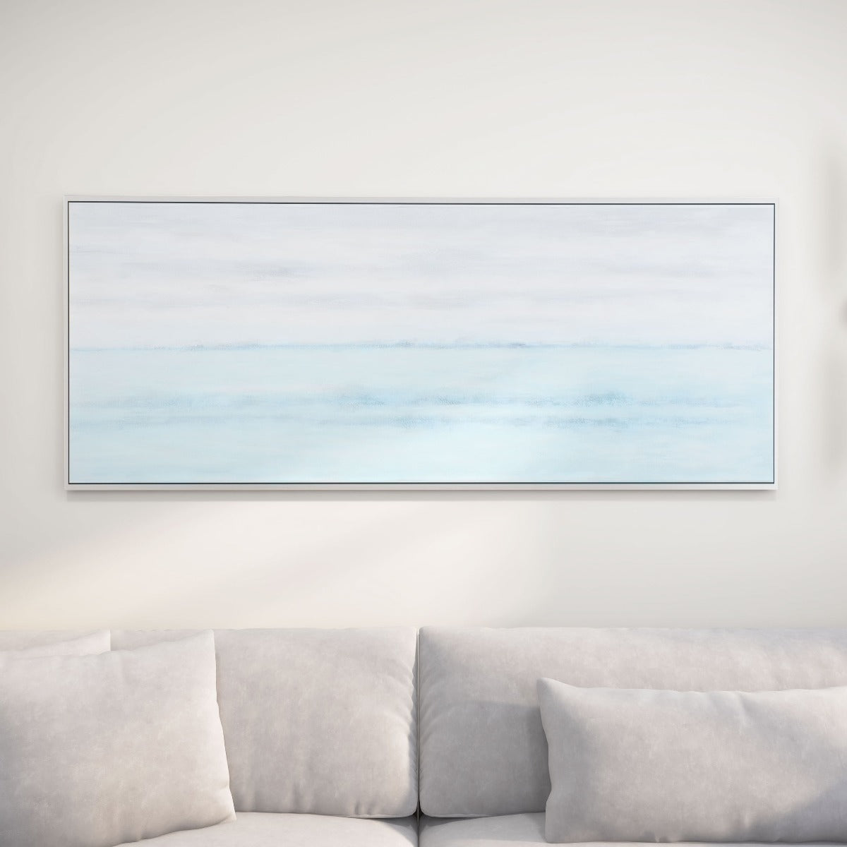 Blue Horizon painting on a beige wall above a light grey sofa, creating a serene living room ambiance.