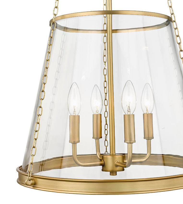 Close-up of brass glass pendant light showing candle-style bulbs and frame detail.