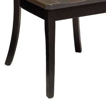  Focused image of the legs of a black wooden dining chair, highlighting the elegant taper. 