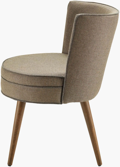 Side view of the Surya Gabby dining chair emphasizing its comfortable backrest and compact profile.