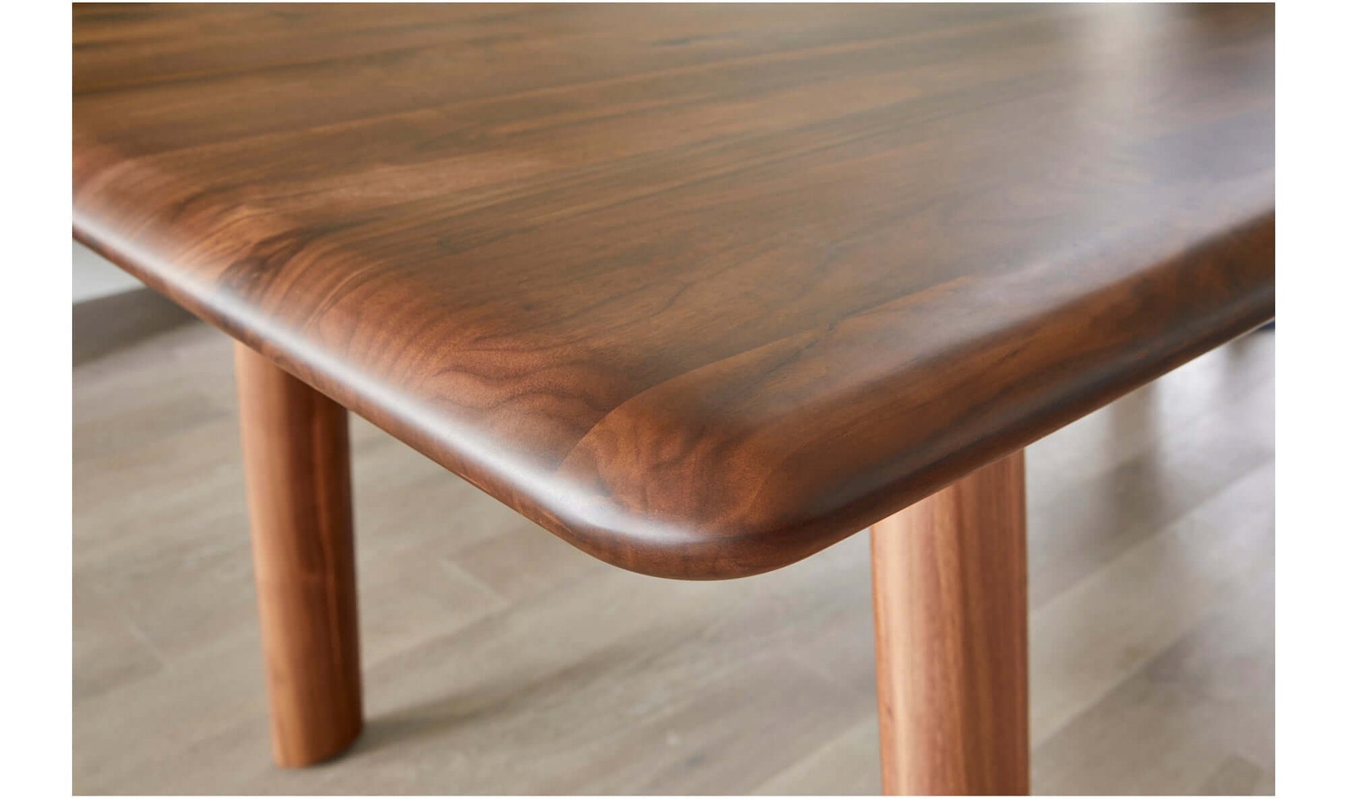 Close-up of Malibu Dining Table's Smooth Walnut Tabletop