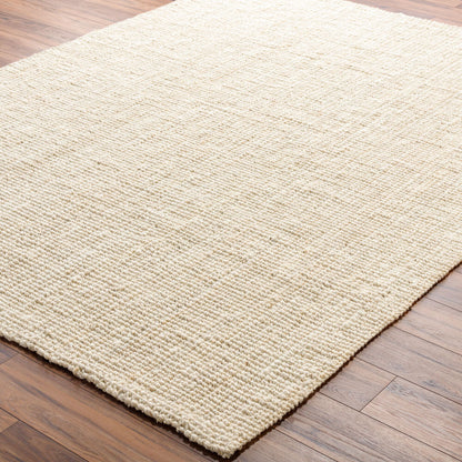 Butter jute rug on hardwood flooring, showing rustic texture and cozy appeal.