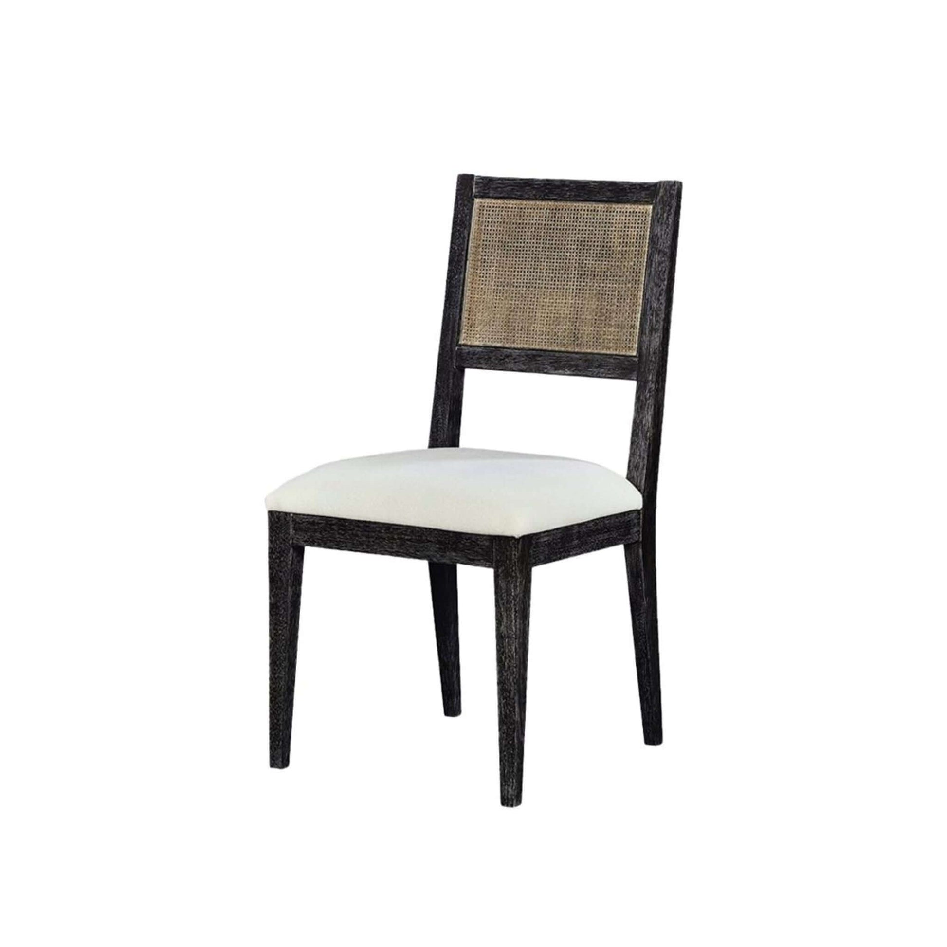 Side angle view of Caine I black dining chair with cane back and upholstered seat.