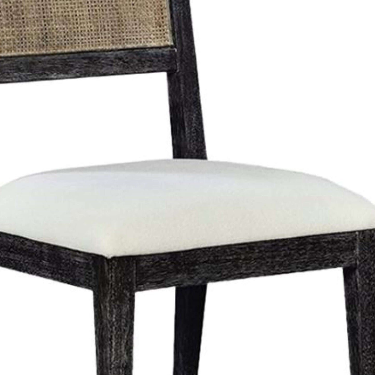 Close-up view of the upholstered seat and cane backrest on the Caine I black traditional dining chair.