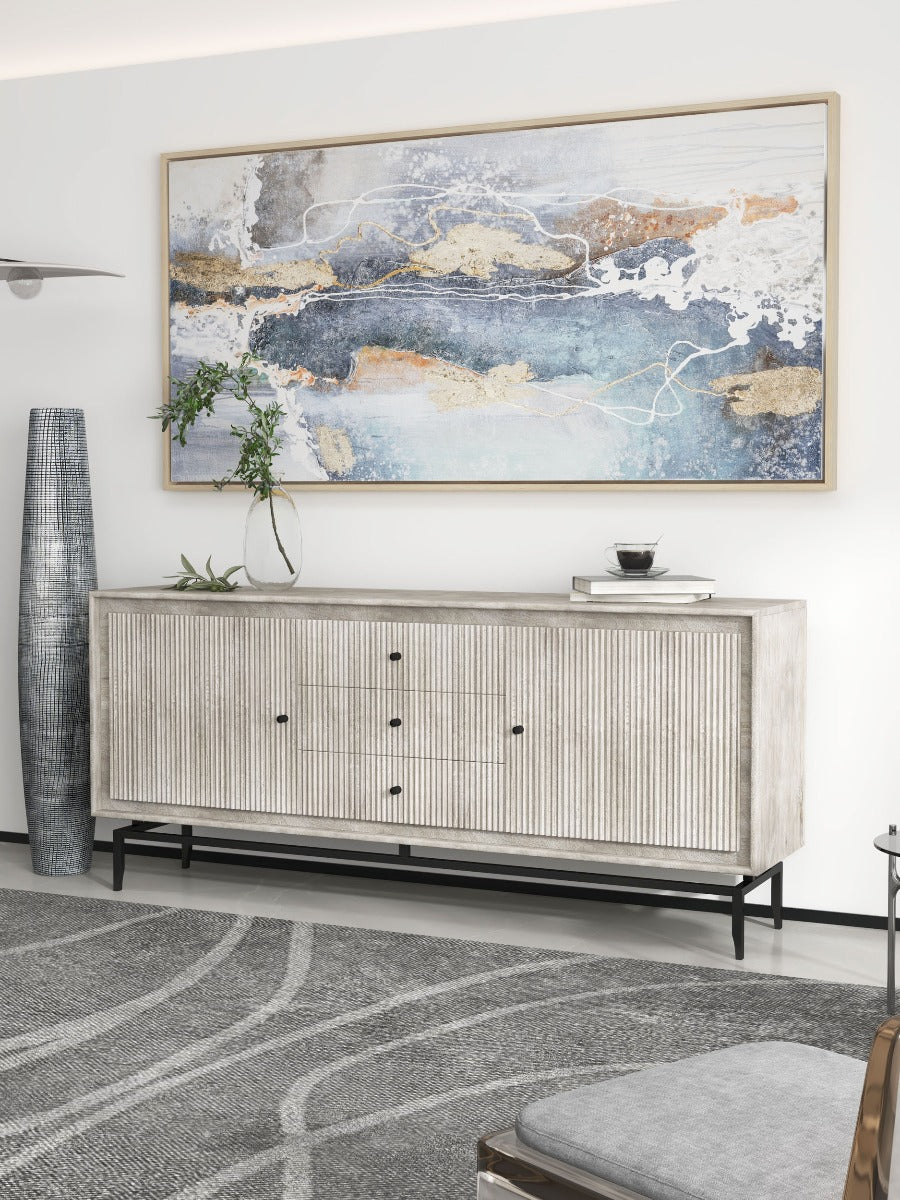 Camilo Dining Sideboard in a bright modern interior with geometric-pattern rug and stylish decorations.