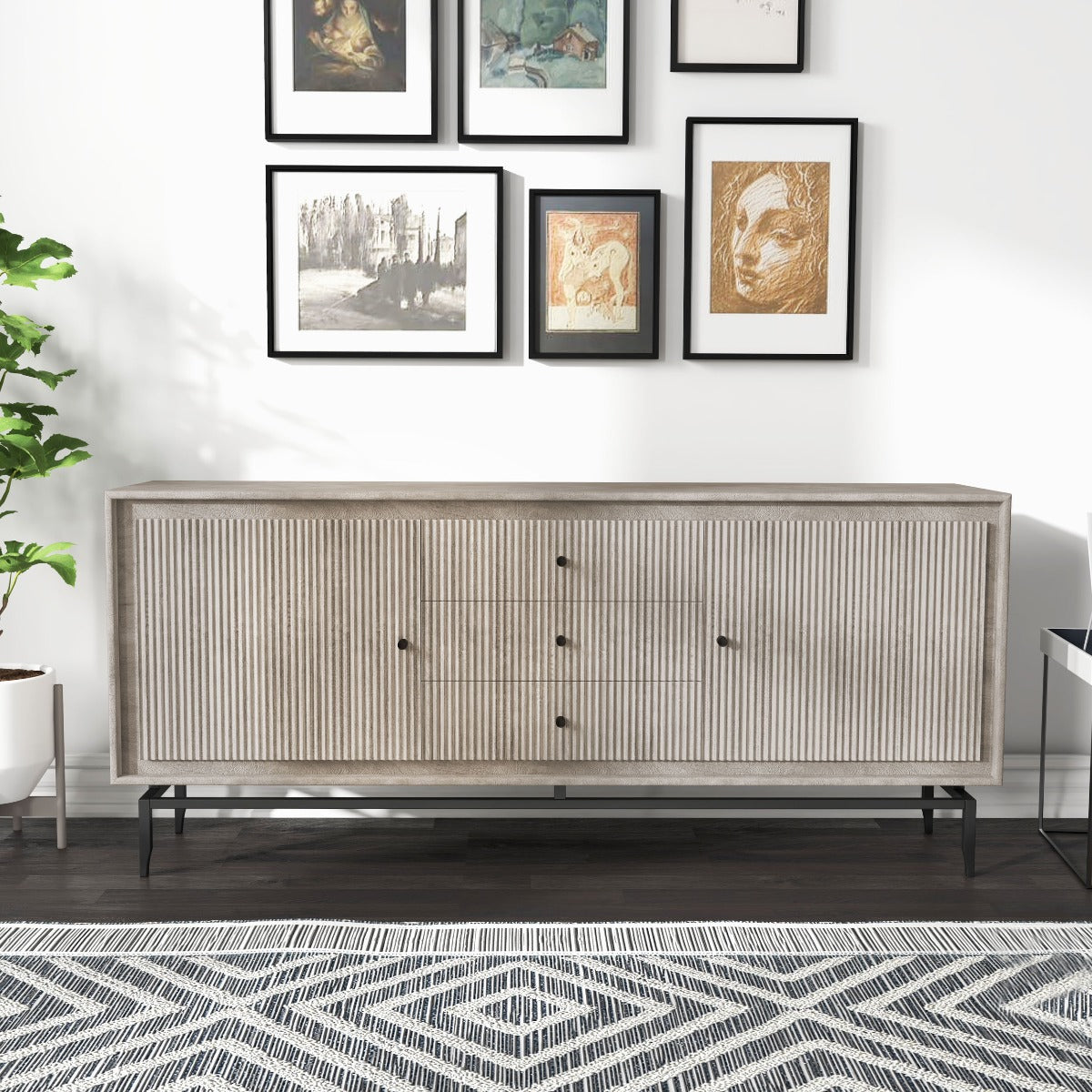  Camilo Dining Sideboard displayed in a modern living room with framed art above and decorative items.