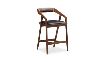 Angled view of the Padma Black Bar Stool, displaying the supportive backrest and casual footrest.