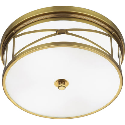 Elegant dining room light with antique brass finish, showcasing intricate crisscross metal framework.