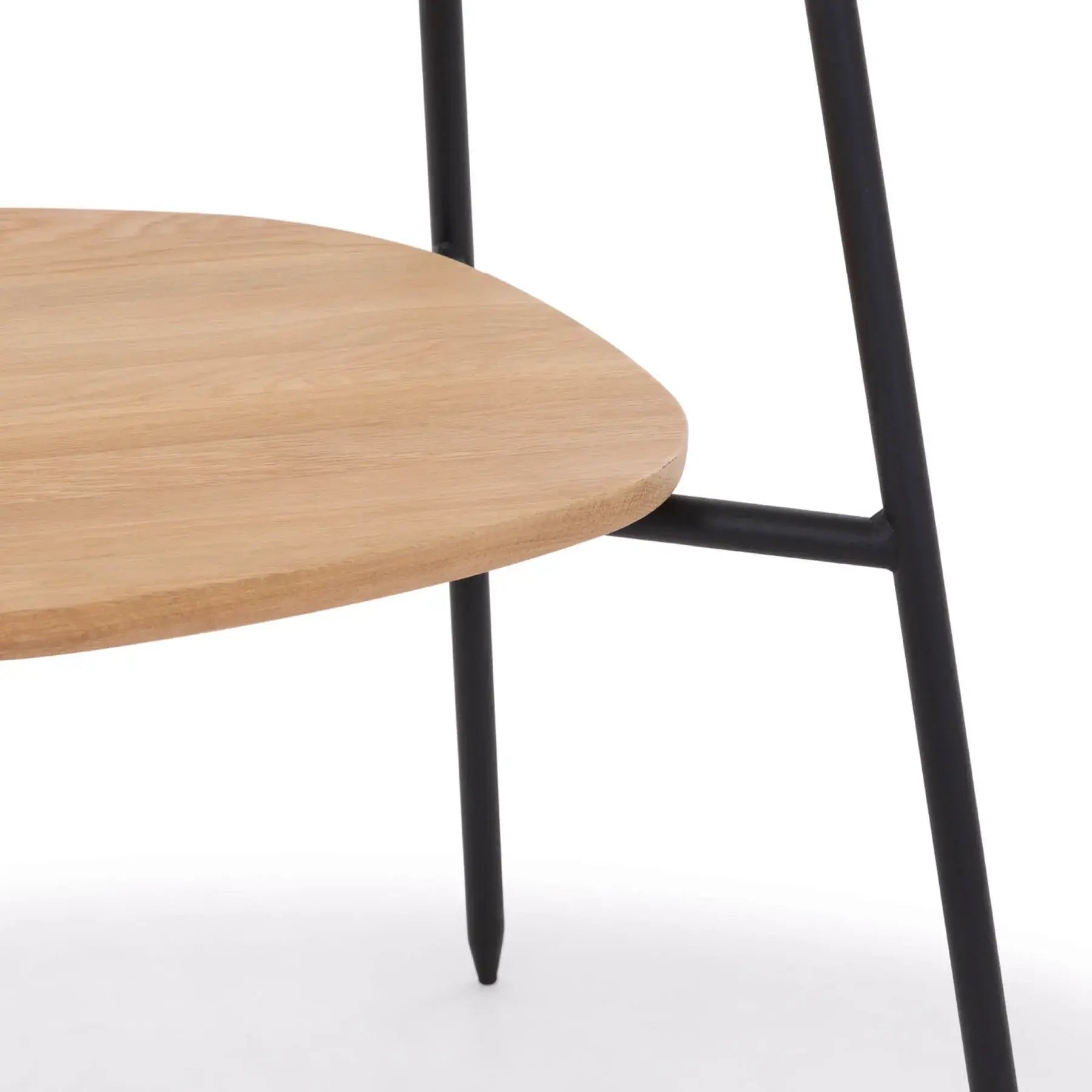 Detail shot of the Colton black metal dining chair's oak seat with black metal frame.