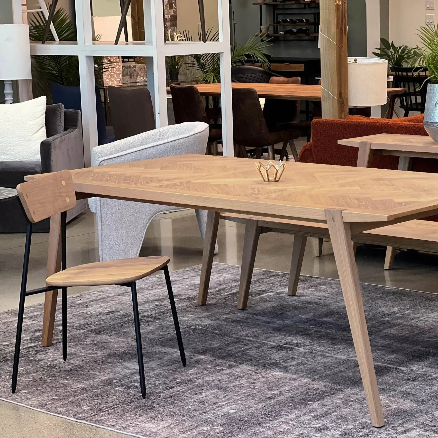 Lifestyle shot of the Colton solid oak dining chair in a modern room setting.