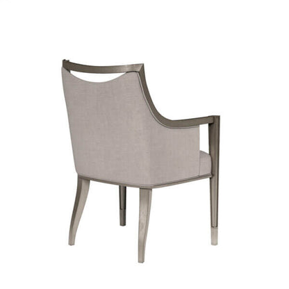  Back view of a transitional dining arm chair with a curved back and pewter metal ferrules, highlighting its elegant design and mica finish.