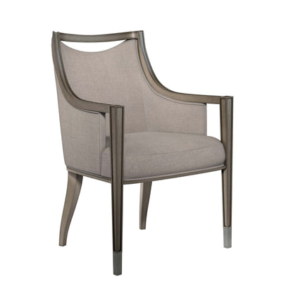 Side view of Cove Dining Arm Chair highlighting the unique curved back and pewter finished metal ferrules.