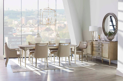 Dining room setup with transitional dining arm chairs, reflecting a warm and inviting atmosphere with natural lighting and stylish furniture.