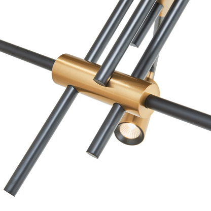 Close-up of Spartan cylinder pendant light connector in black and gold.